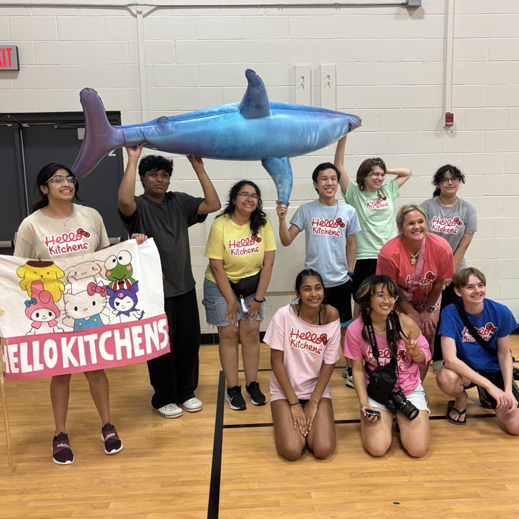 Picture of teenagers posing with an award for school.