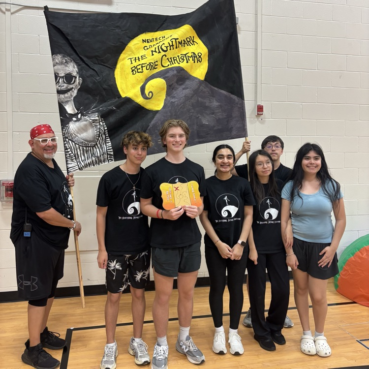 Picture of teenagers posing with an award for school.