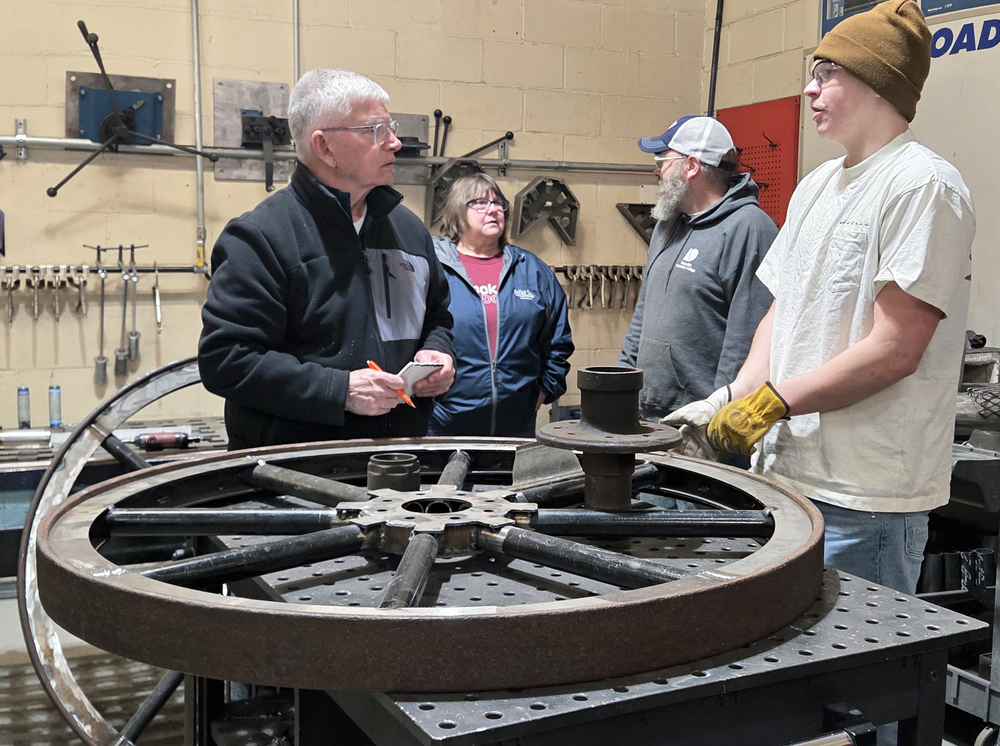 Jim Huovinen, Osceola Township Veterans’ Ad Hoc Committee member, speaks to Liam Tourtilott, CCISD CTE Welding and Manufacturing and Dollar Bay Senior Student