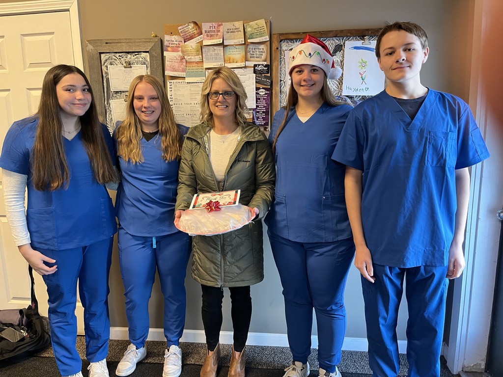 Students Dayonna Picard and McKayla Kemppainen at left, Kristie Rehn from Align Chiropractic in middle, and students Stella Makela-Sweeney and Ivan Johnston at right.