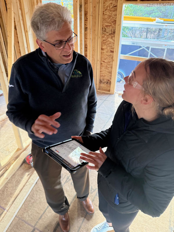 Student with Fittante looking at Technology