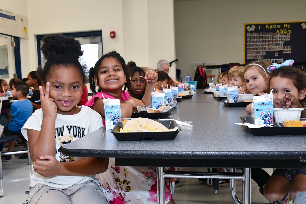 Happy students at a lunch table