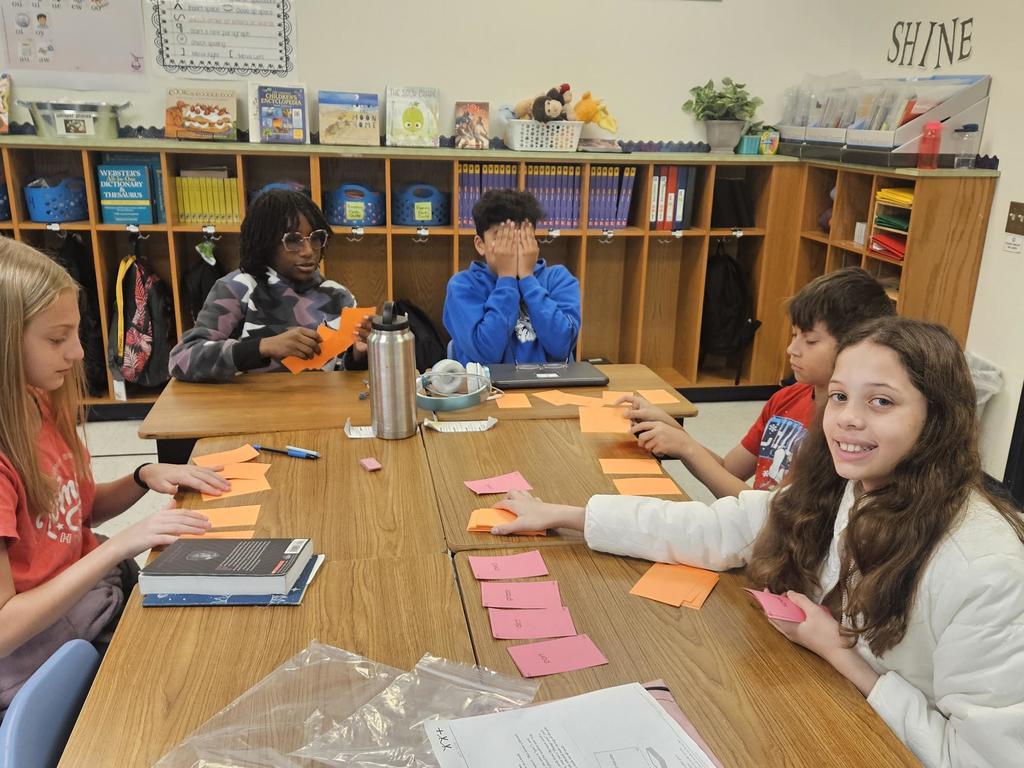 Five students playing a game.