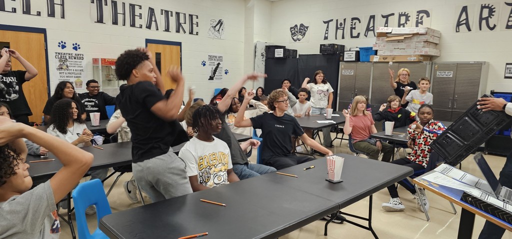 students throwing paperballs