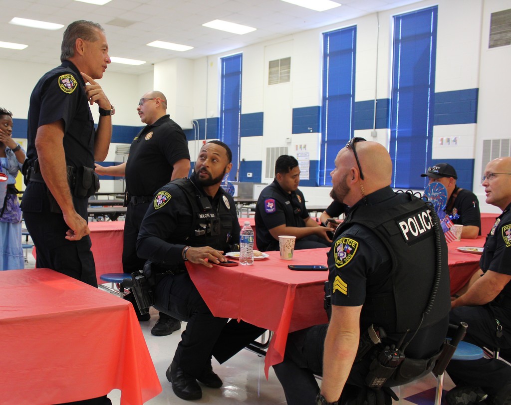 First responders chatting at cafeteria table
