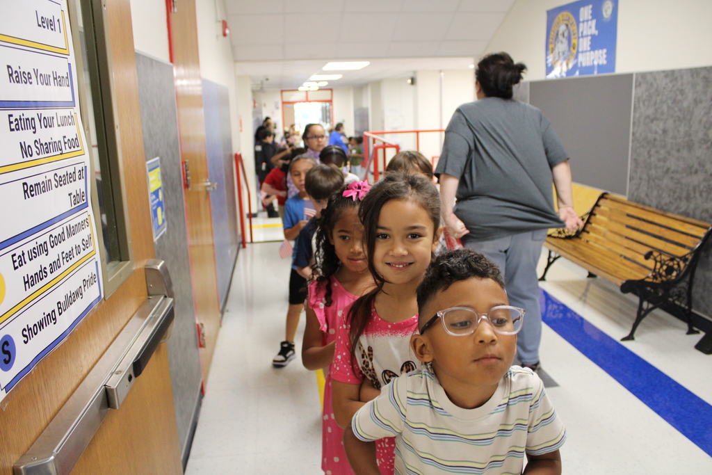 First graders excitedly line up to greet First Responders