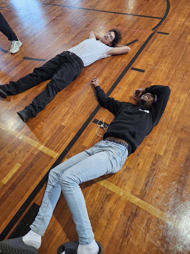 Picture of students recovering on the floor.