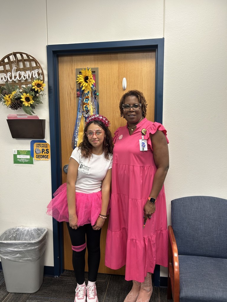 Camille George and a student show their school spirit.