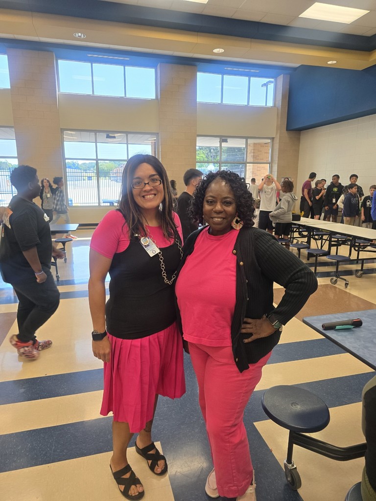 Alicia Weikum and Candace Martin wore pink to support the 7th grade.