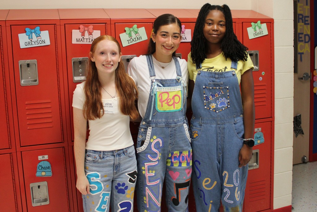 Student teachers smile in homecoming gear