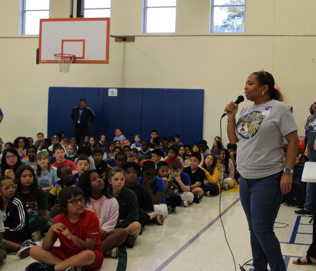 Dr. Sweeney speaks to students in gym