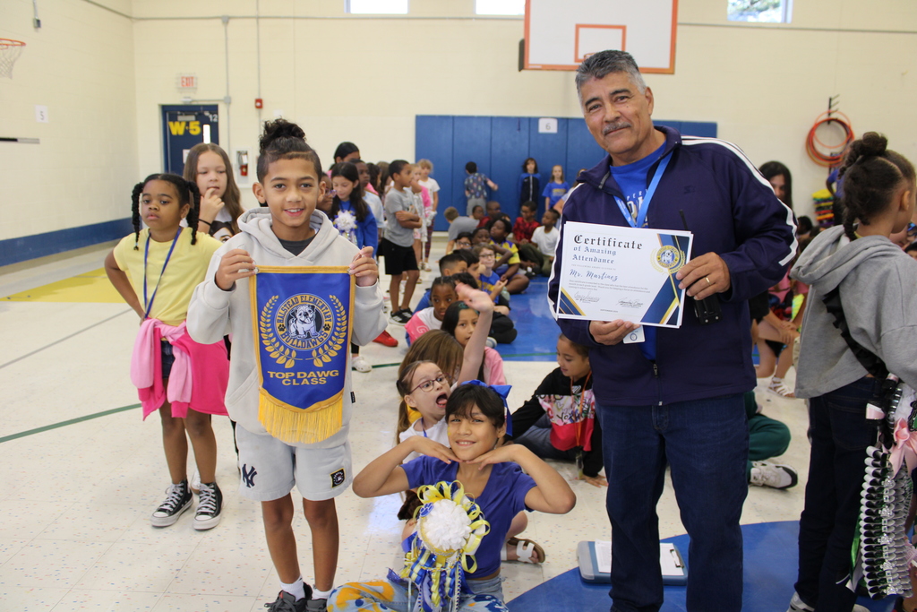 Mr. Martinez poses with class and Top Dawg banner