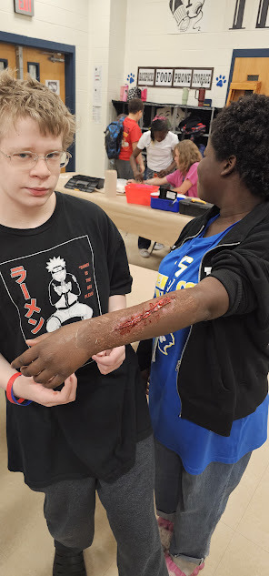 Theater students showing off their wound make-up skills.