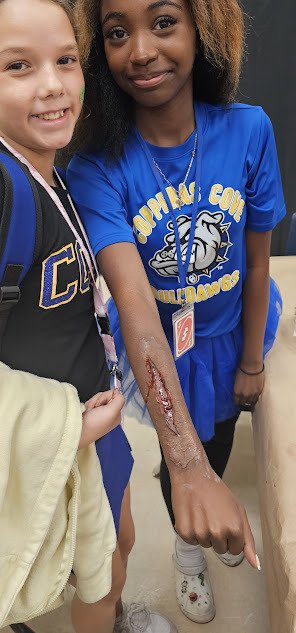 Theater students showing off their wound make-up skills.