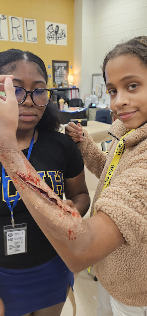 Theater students showing off their wound make-up skills.