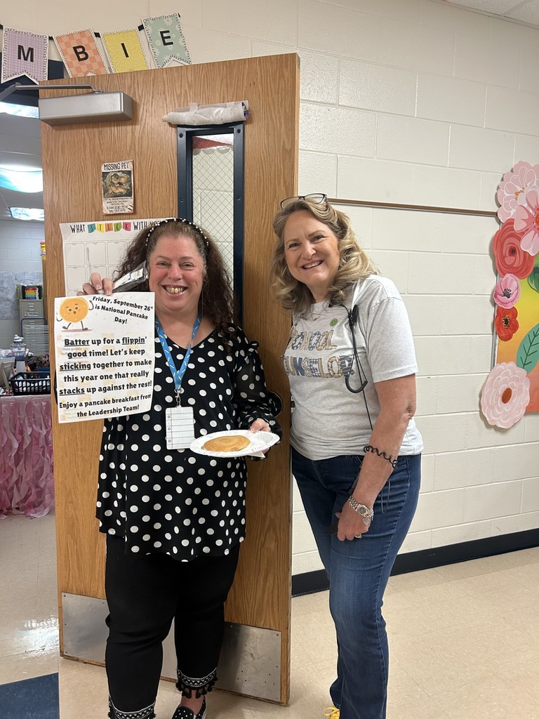 Teachers and staff celebrating National Pancake Day.