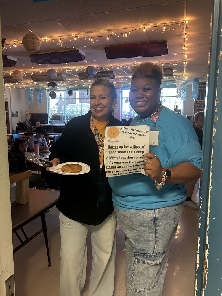 Teachers and staff celebrating National Pancake Day.