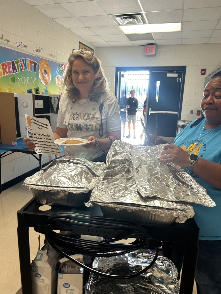 Teachers and staff celebrating National Pancake Day.