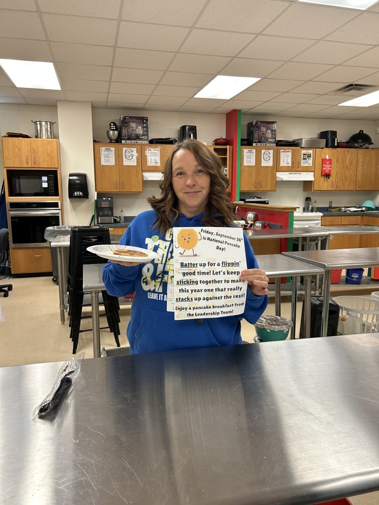 Teachers and staff celebrating National Pancake Day.
