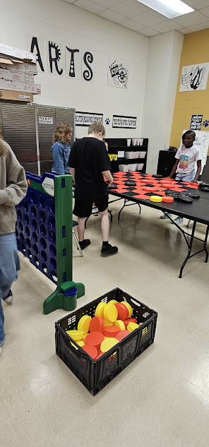 Students playing giant checkers