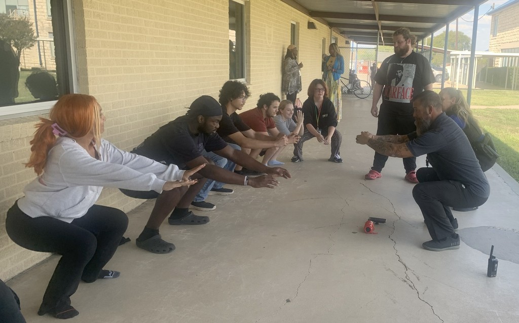 Students and Staff in squat challenge