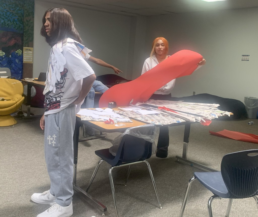 Crossroads Students working on recycled fashion projects.