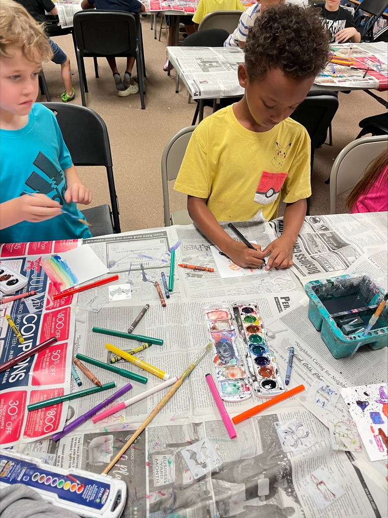 High school students teaching elementary students.