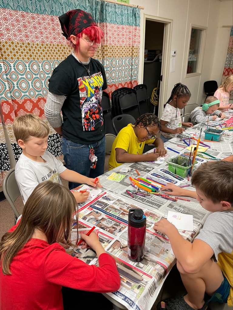 High school students teaching elementary students.