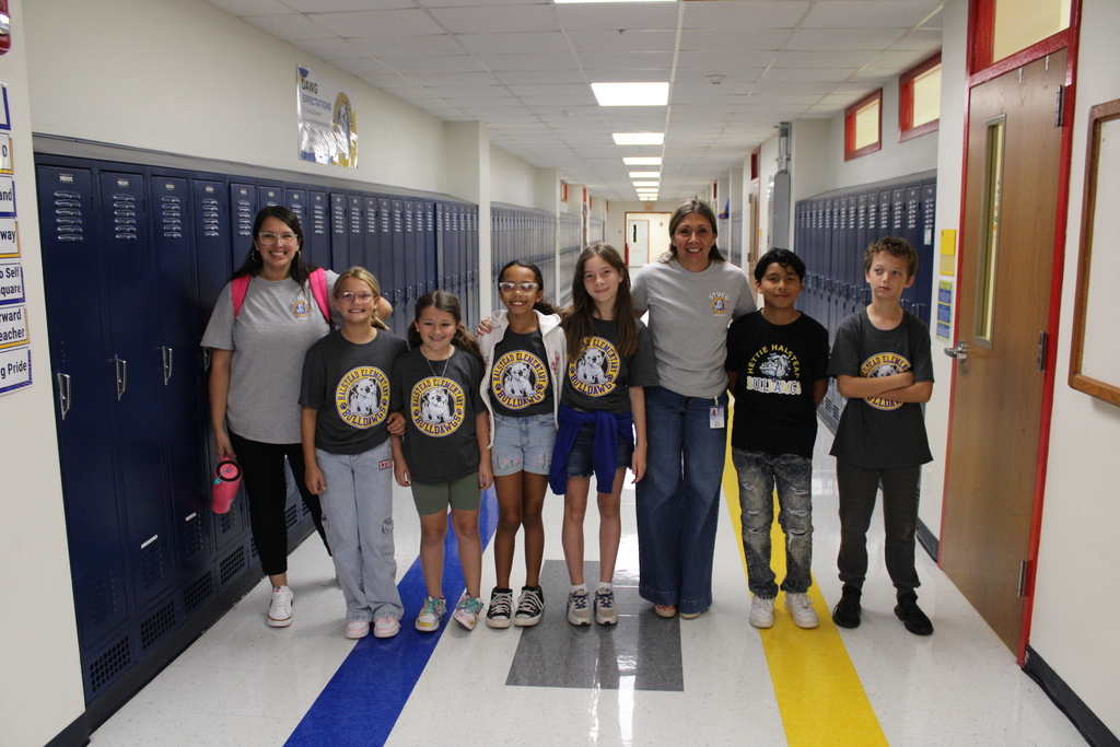 Two teachers and six of halstead Student council pose in hall