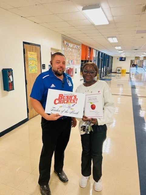 Mr. McNeel congratulating Jakhi Smith