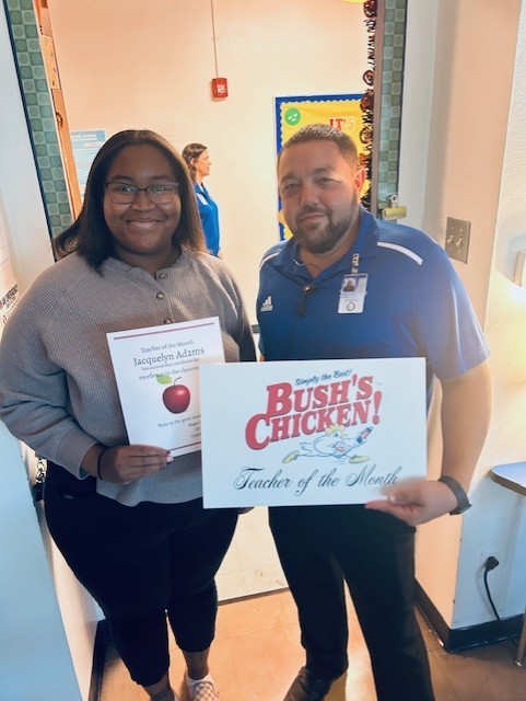 Mr. McNeel congratulating Jacquelyn Adams