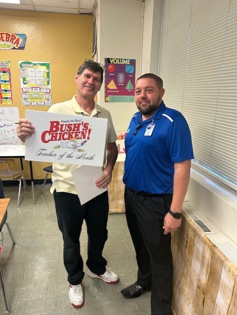 Mr. McNeel congratulating Rex Burke
