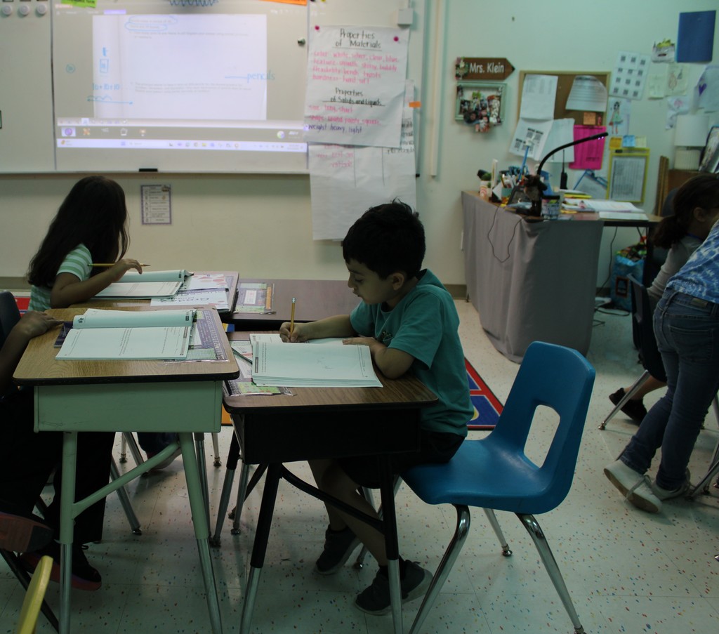 student writes in wor