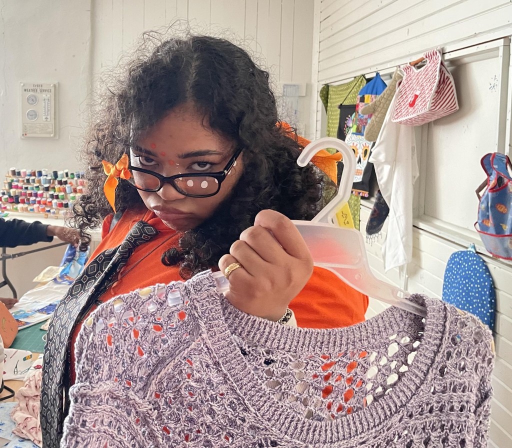 Picture of Antara with sweater she is customizing