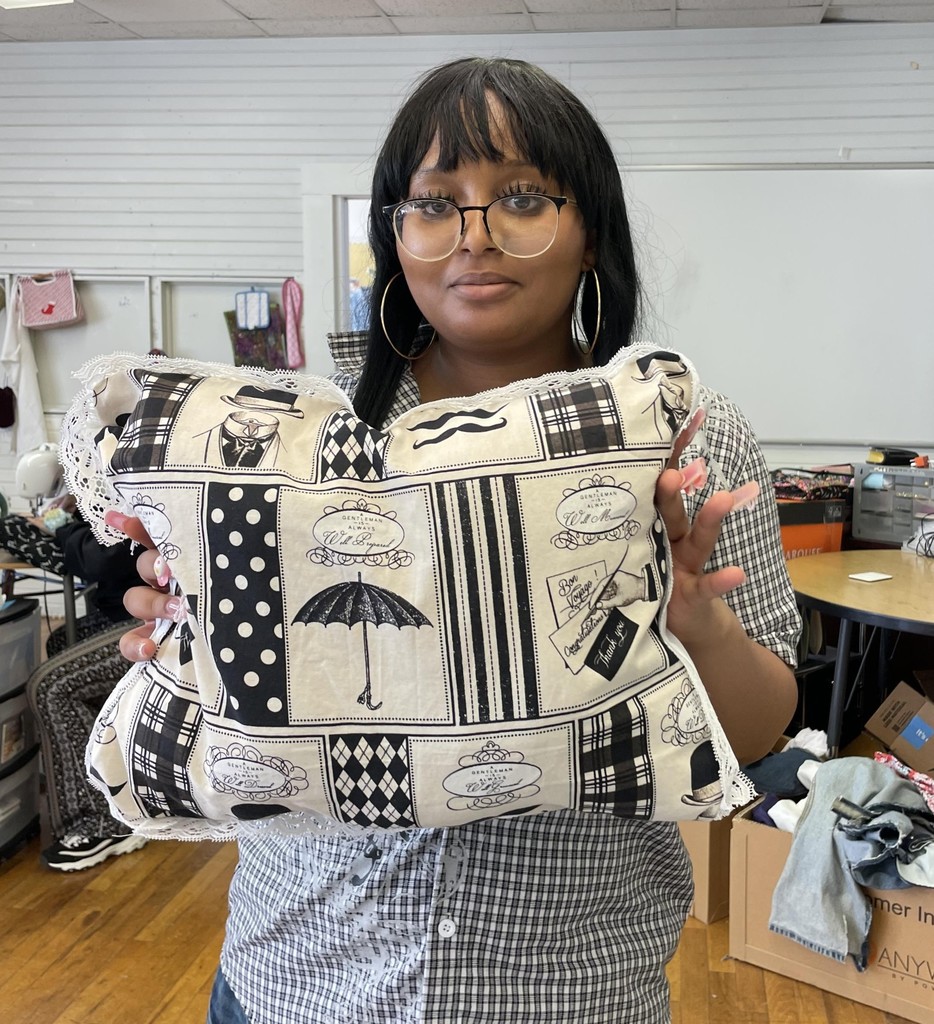 Picture of Nyla with her finished pillow