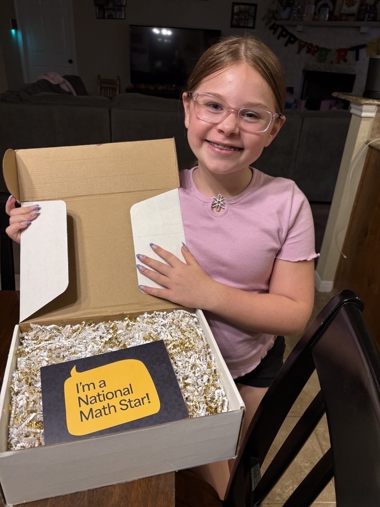 Smiling girl holding a box