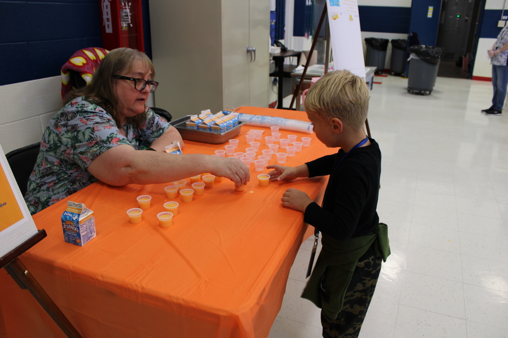 Student choosing sample of milk