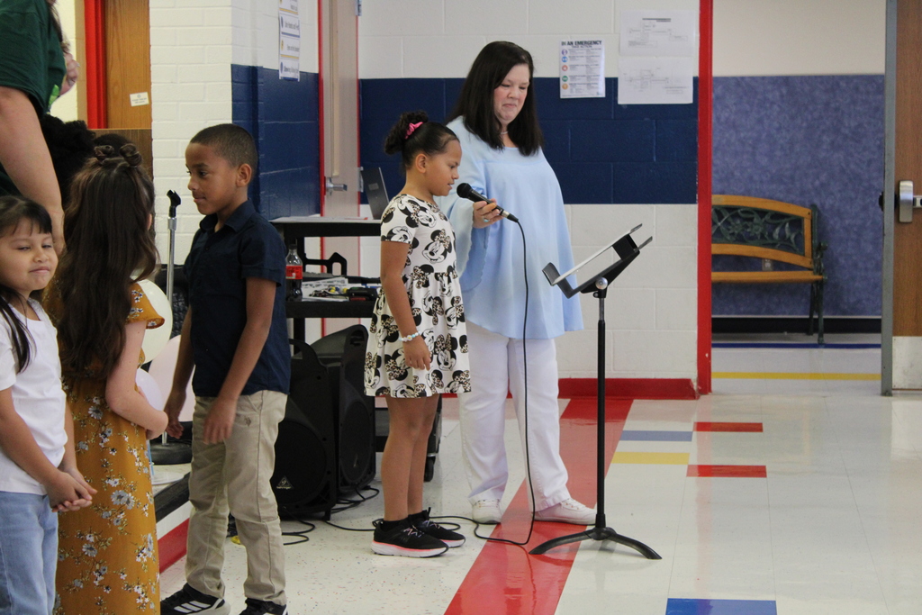 3rd grade music program students speaking on microphone
