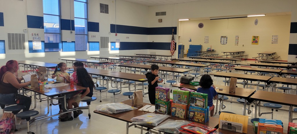 Photo of families at family game night details in caption