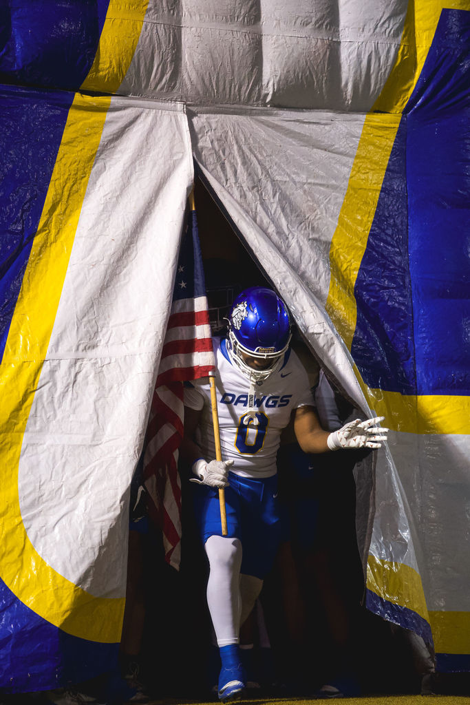 Copperas Cove High School football athletes playing a game against De Soto.