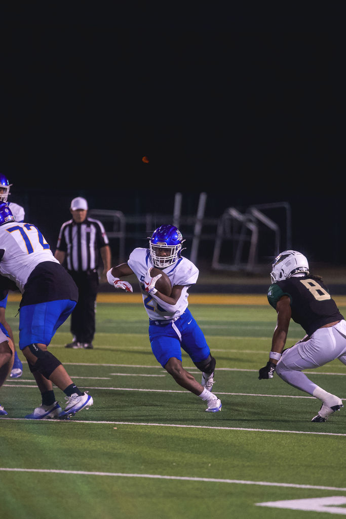 Copperas Cove High School football athletes playing a game against De Soto.