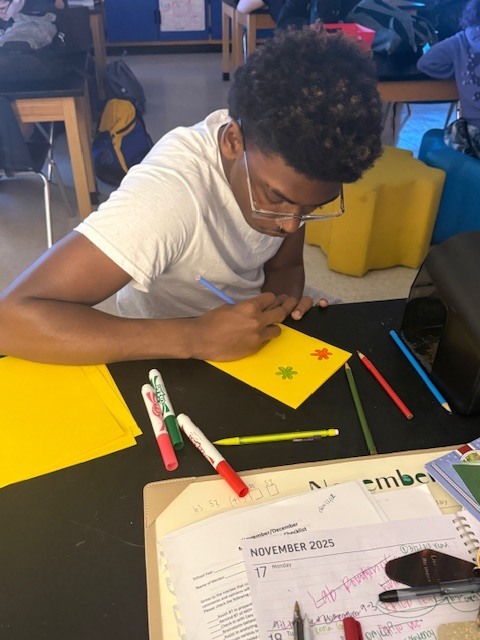 Students creating cards for faculty and staff for Thanksgiving