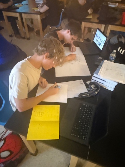 Students creating cards for faculty and staff for Thanksgiving