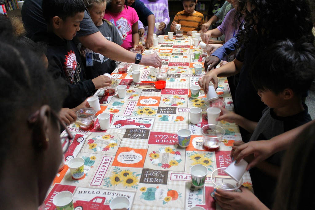 students mix in potion ingredients