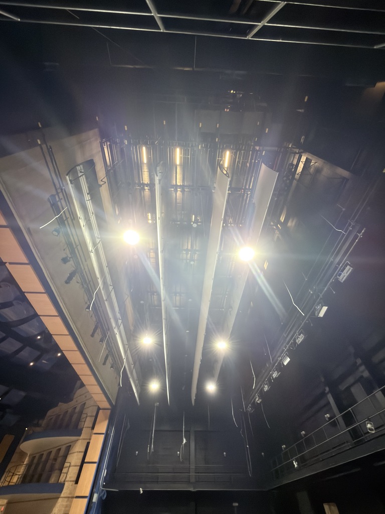 Photo of curtains and rigging above auditorium stage