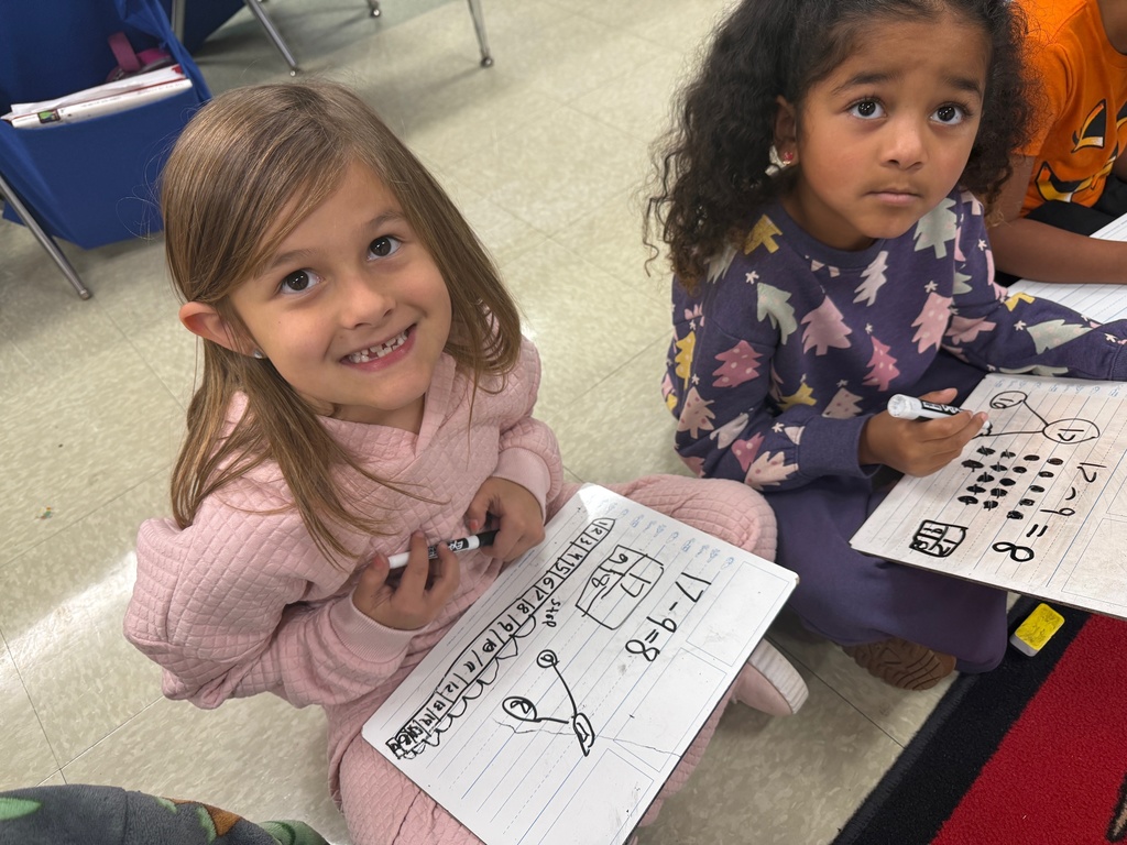 Students smiling during a math activity