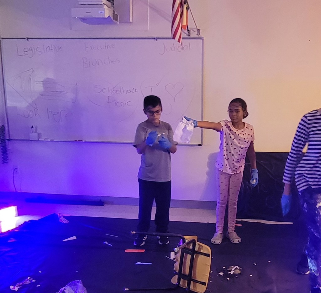 Sudents hold up evidence