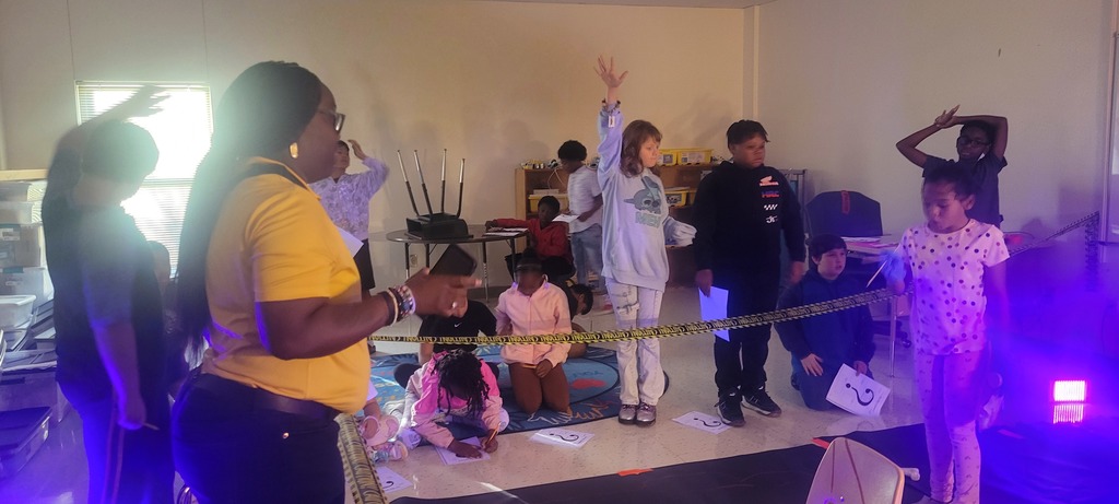 Students raise hands to answer questions