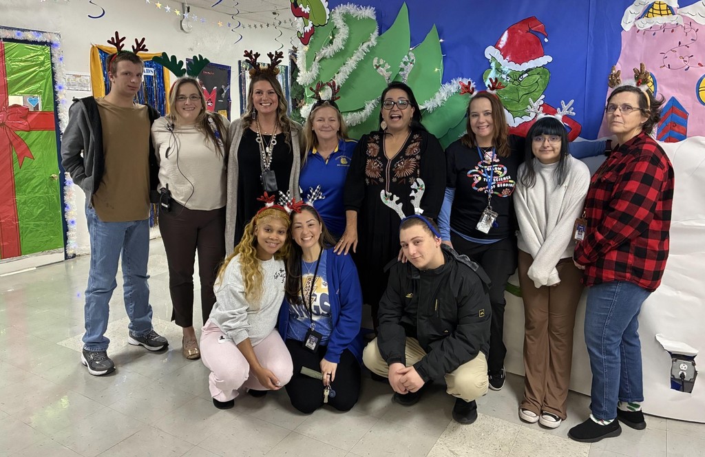 Picture of staff and students wearing antlers