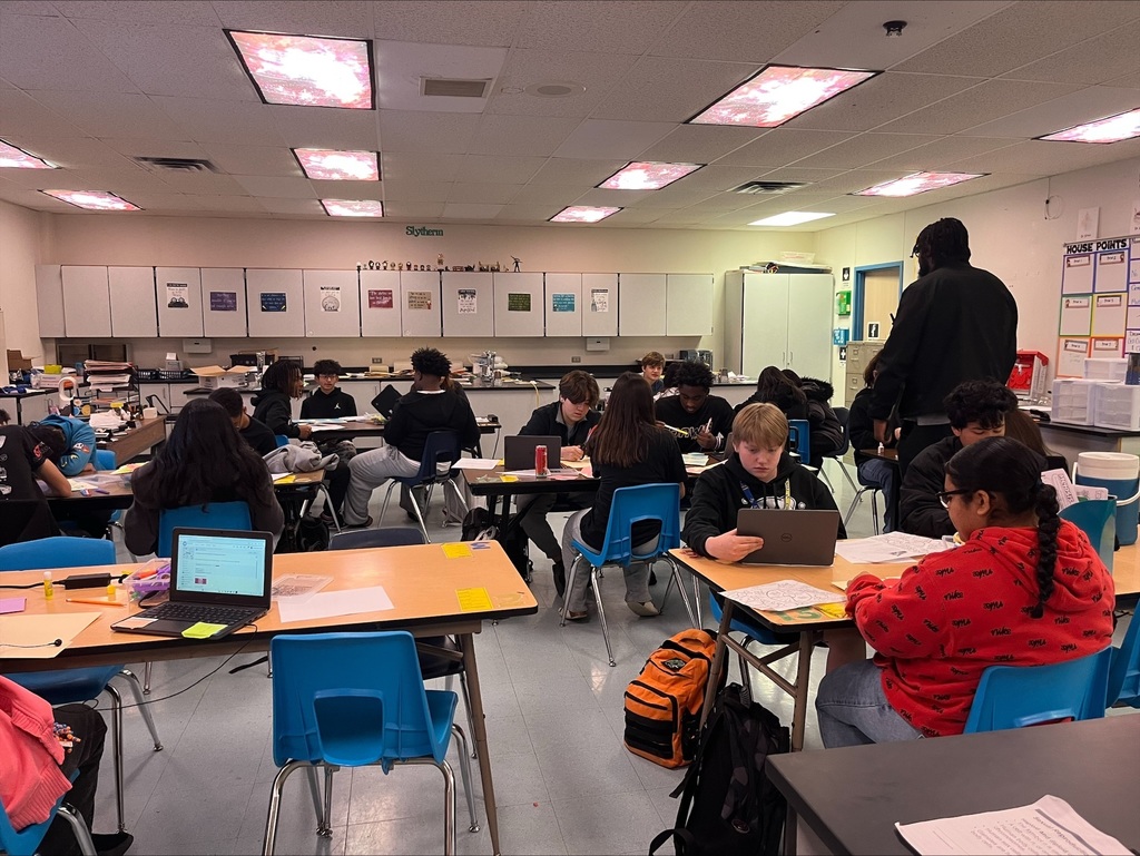 Students in a classroom working through an activity